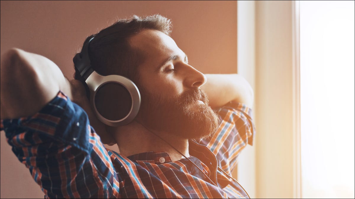 man-headphones-listening-eyes-closed